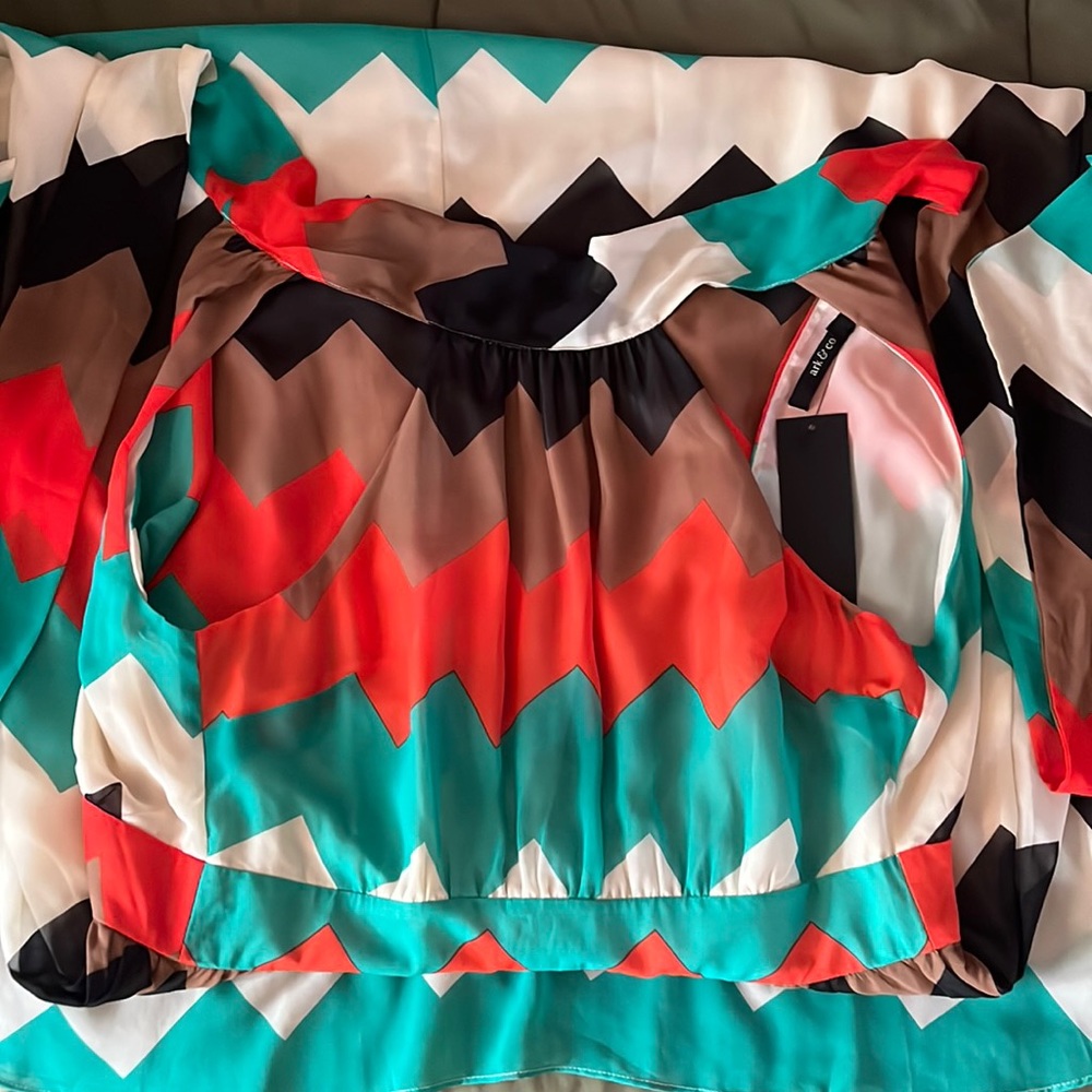 Never worn. Tag still on. Multi colored maxi halter dress.